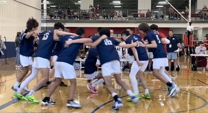 Boys team huddle before a match