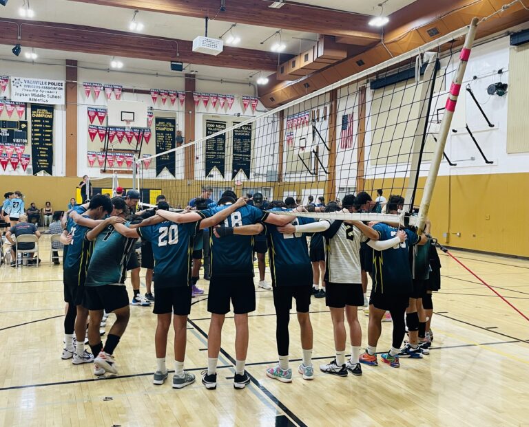 Sports 6 Boys Circle Up Before Volleyball Game