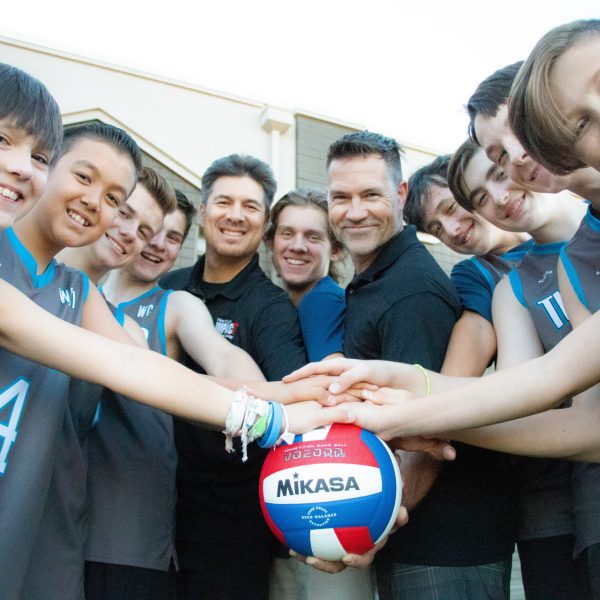 Become A Coach 6 Volleyball Team Putting Hands On A Volleyball